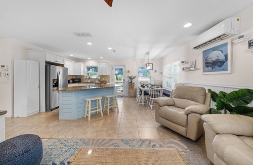Butler Beach House | Backyard Paradise/Pool, Fire Pit, Games, & Kayaks on Canal Front near Beach