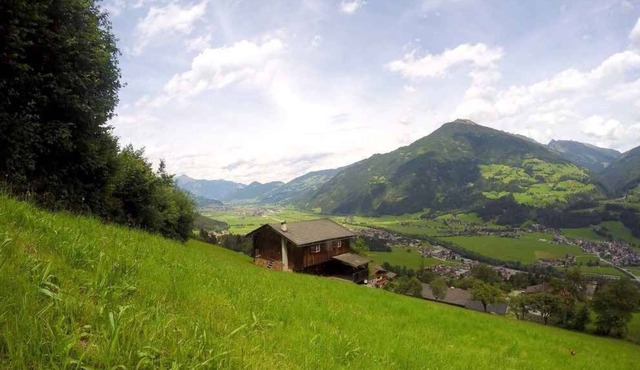 Holiday home with covered waterfront terrace at the forest with beautiful panoramic views directly on the slopes