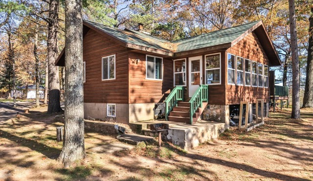 Lakeside resort cabin right on Little Saint with dock, sandy beach, firepit! in St.Germain