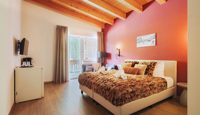 Mountain View Deluxe: enjoy mountain views together, a balcony, and alpine luxury. Perfect for a romantic stay in summer or winter.